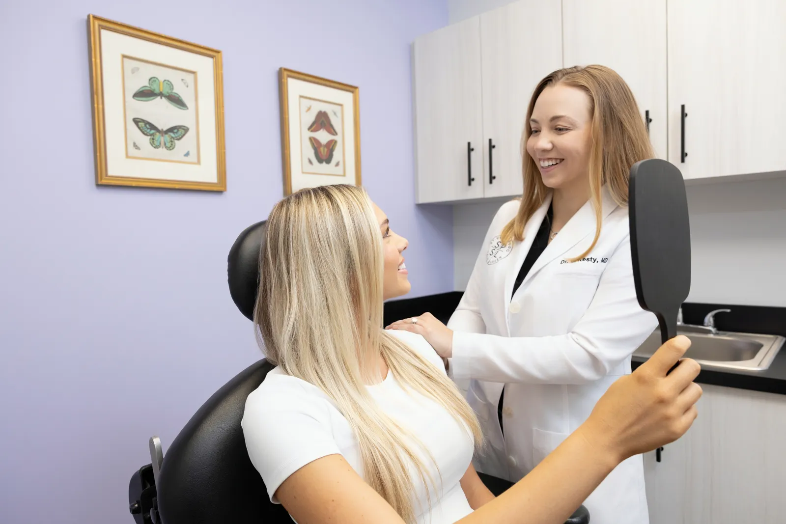 Dr. Chelsea Kesty reviewing treatment goals with a patient before a Picosecond Laser Facial